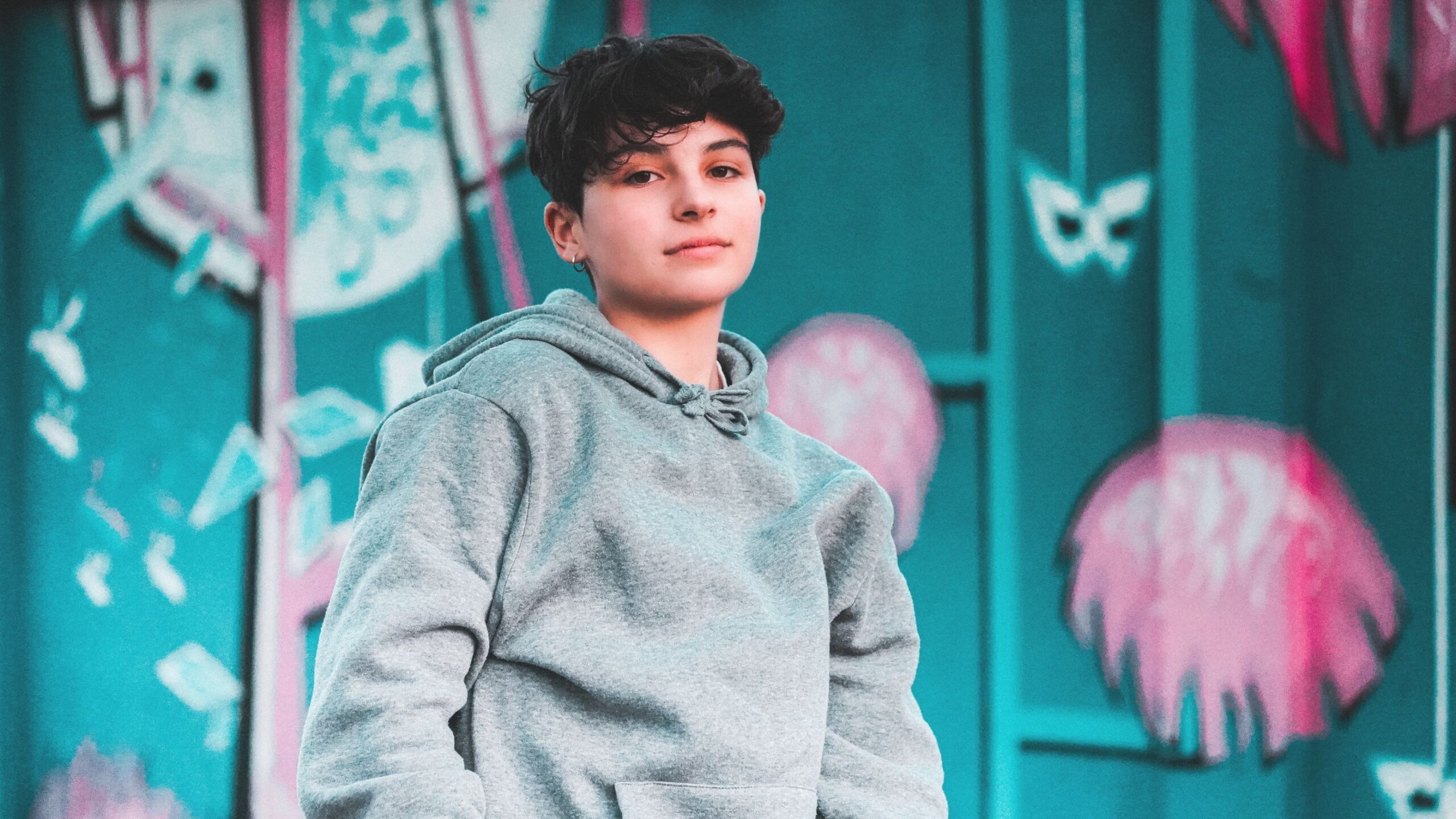 A young boy is looking into the camera.