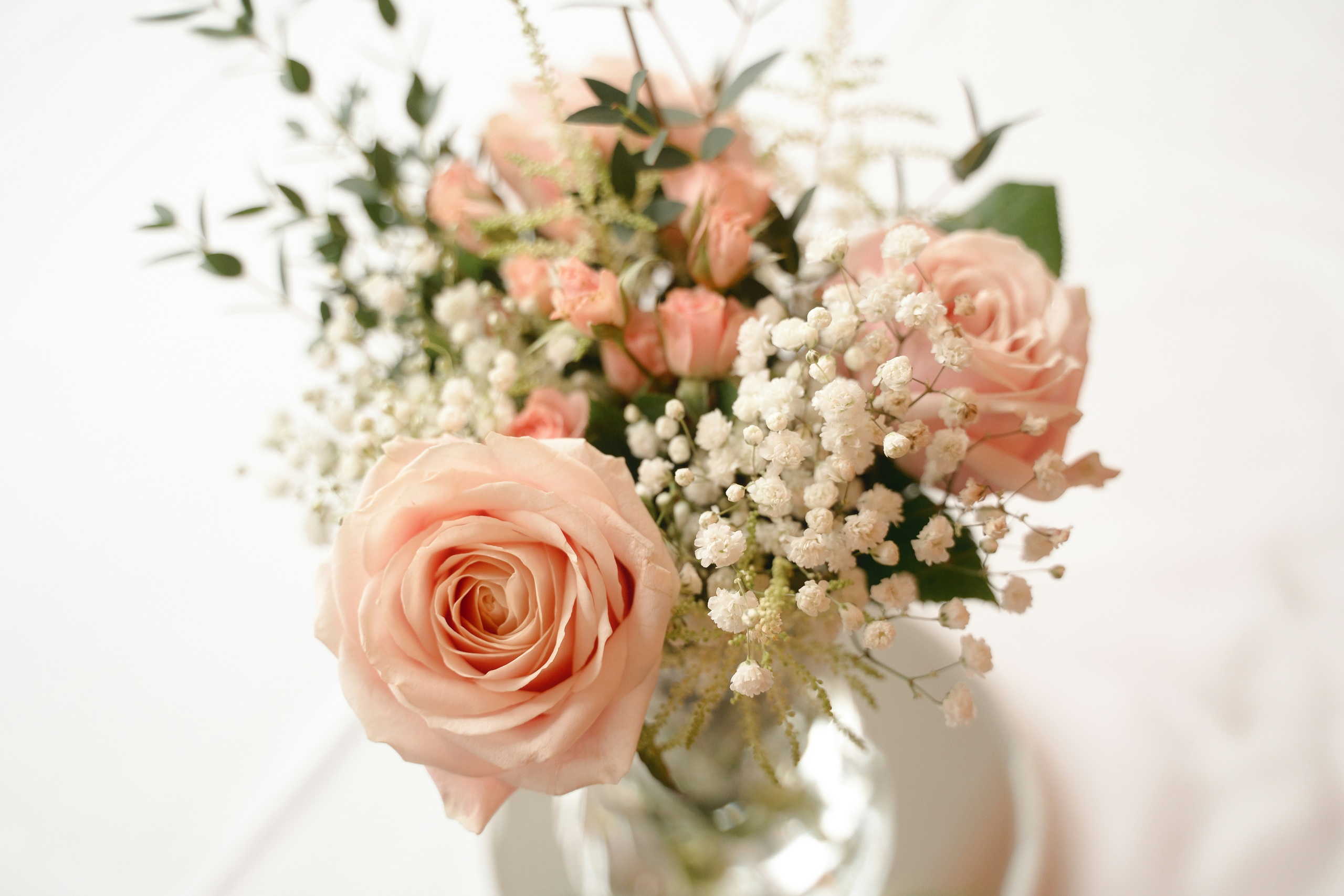 A wedding bouquet with pink and white flowers.