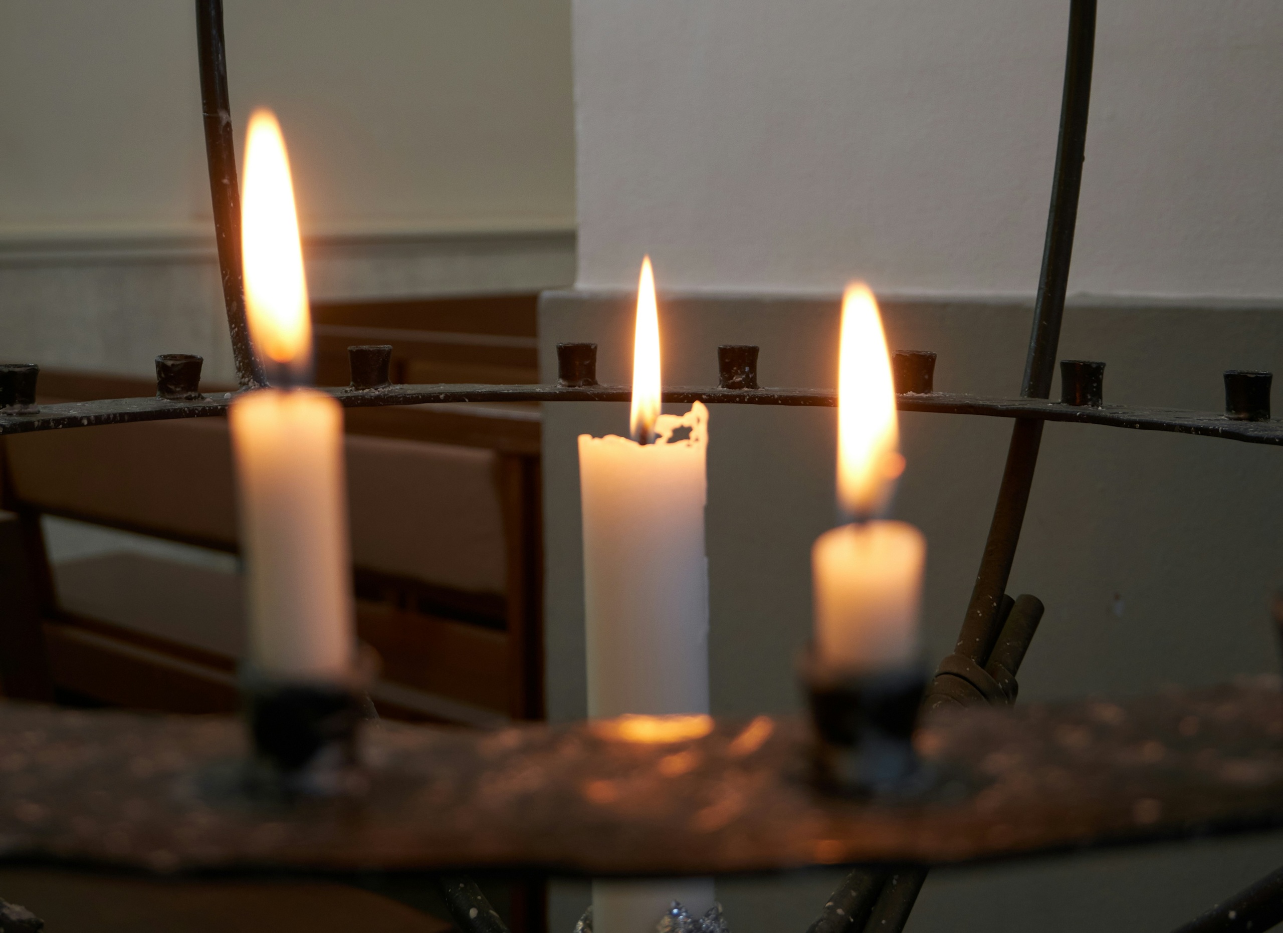 Three lighted candles
